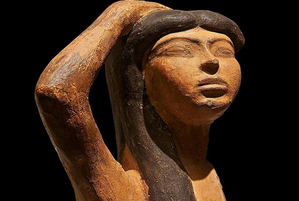 A portrait or statue of Isis, possibly from an ancient temple or artifact.