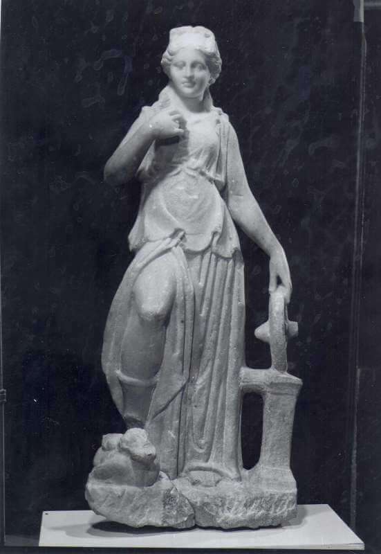 An ancient statue or figurine of Nemesis.
